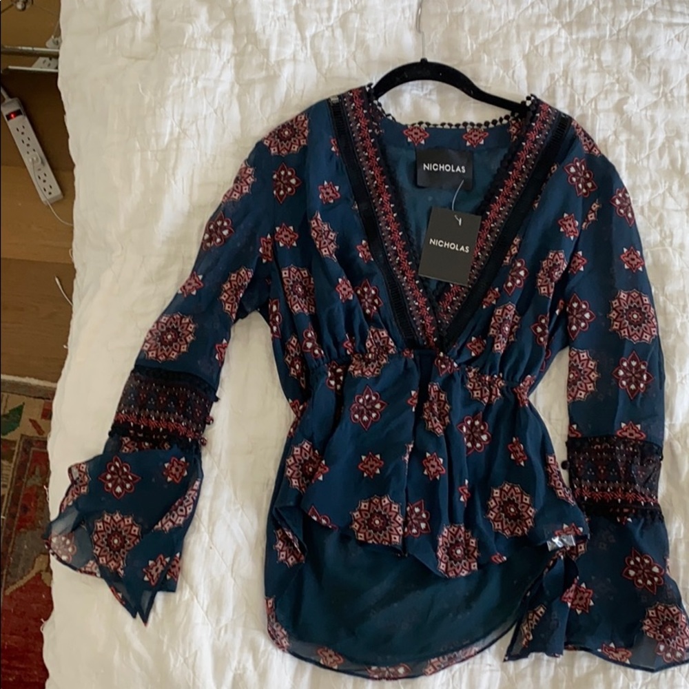 Top with 3 quarter length sleeves.